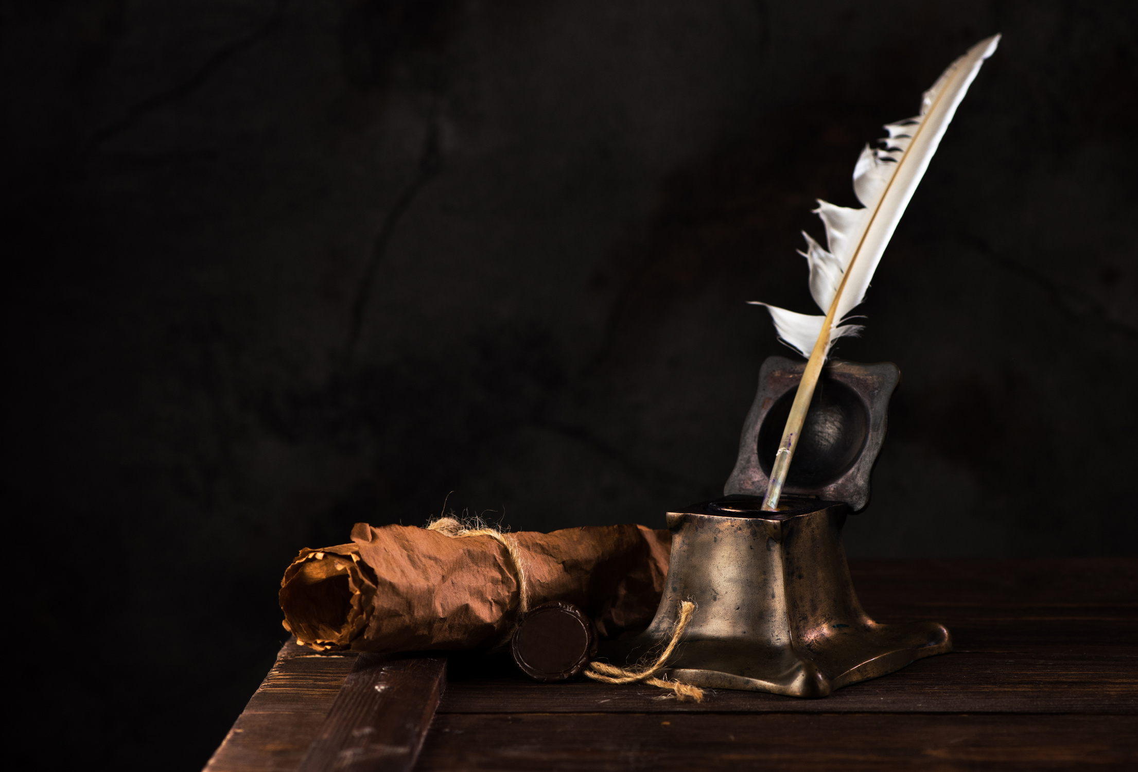 Ancient Inkwell, feather pen, old scroll paper with a seal